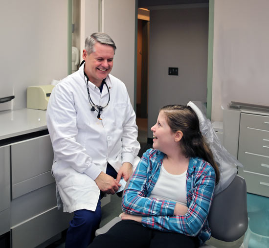 Dr. Wendell King with a patient